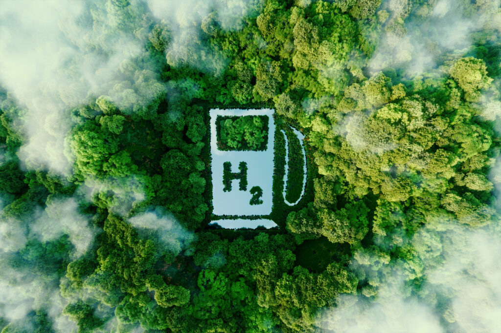 Depositphotos - Petróleo y Energía A lake in the shape of a hydrogen filling station used as a concept to illustrate the environmental friendliness of hydrogen and its potential as the fuel of the future 3d rendering Depositphotos