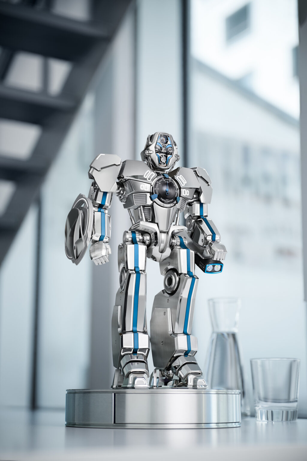 Stacked from 12 images Method=B R=1S=1 - Petróleo y Energía Shiny silver humanoid robot statue on a circular pedestal in a modern, glass-walled interior.