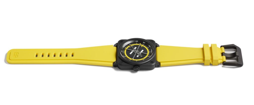 R11-BR-003-BR03 HELIPAD-COUCHER - Petróleo y Energía Yellow silicone-strap watch with a black square case and yellow-accented analog dial.